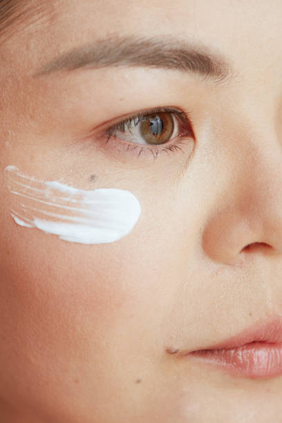 istock Closeup on woman with eye cream on face 1429952130