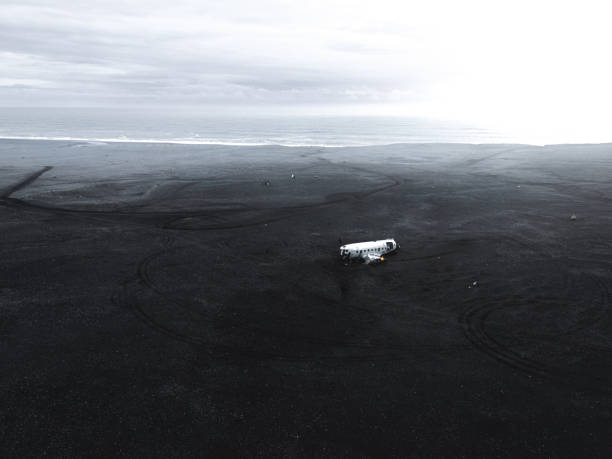 istock Aerial view of a wrecked plane on black beach in Iceland 1429952437