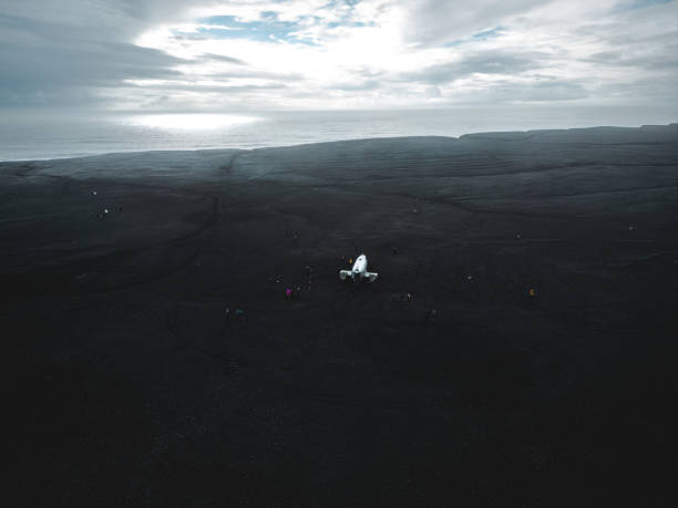 istock Aerial view of a wrecked plane on black beach in Iceland 1429952439