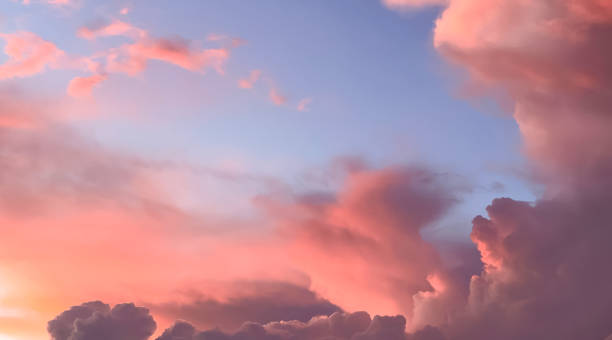 istock Beautiful sunset, with pink and orange clouds on soft blue sky 1429954269