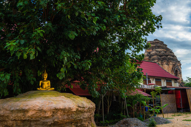 istock Ancient buddha figures in the Phan Tao temple  is a Buddhist temple in the historic centre tourist attraction an ancient Thai art and is Public places in Chiang Mai,Thailand. 1429954317