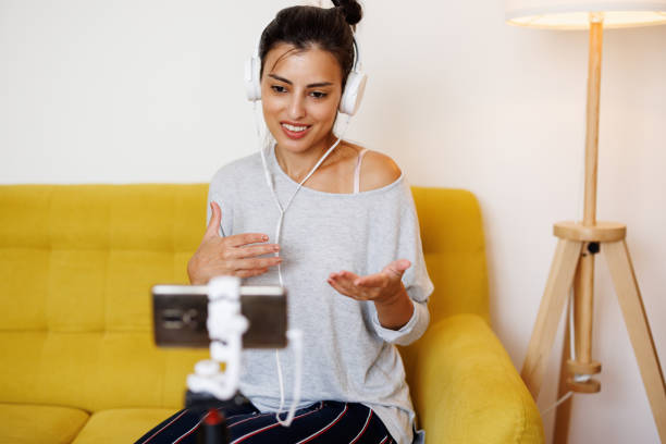 istock Beautiful female teacher giving classes online from home 1429955813