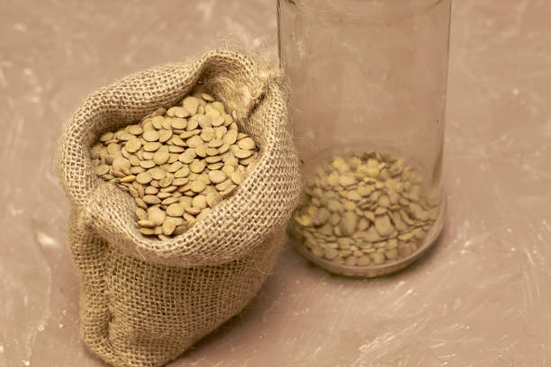 istock lentil grains in a canvas bag and in a glass jar on the table 1429956068