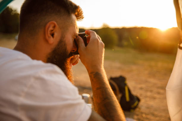 istock Sitting in a tent, camping and looking at nature and wildlife through binoculars 1429961025