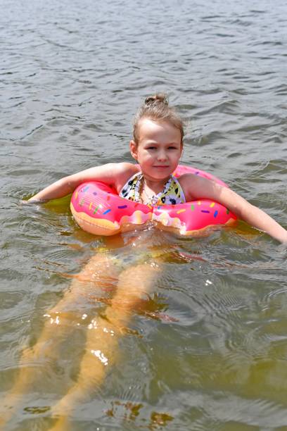 istock A beautiful little girl swims 1429962195