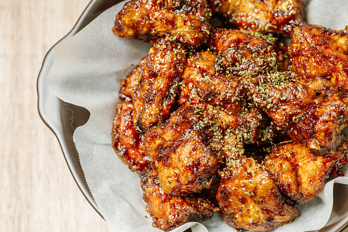 yangnyeom chicken, Korean style Seasoned Fried Chicken : This dish is seasoned chicken cut into pieces, deep- fried, and mixed with soy sauce, gochujang, or other sauces. It has a mild yet spicy taste that makes it ideal for a snack, with or without alcoholic beverages.