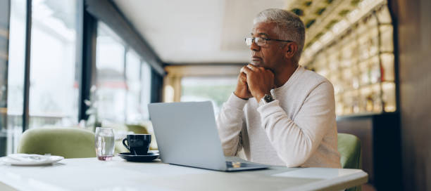 istock Thoughtful businessman working in a cafe 1429966519