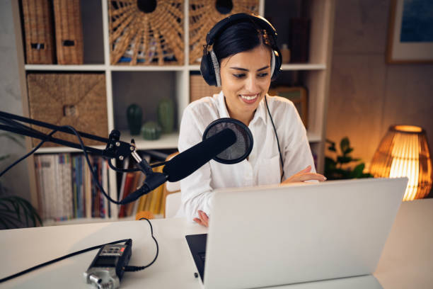 istock Caucasian female influencer from her home studio recording podcast 1429967841