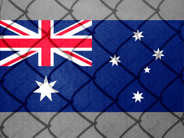 istock Backlight Backlight with actual Australian flag and barbed wire. Prison concept with border image. Double exposure hologram. 1429969831