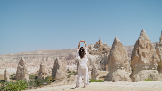 A young female traveler is walking in Cappadocia Türkiye.