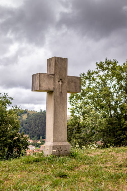 Christian crosses surrounding an old baroque church on top of a mountain, in the north of spain