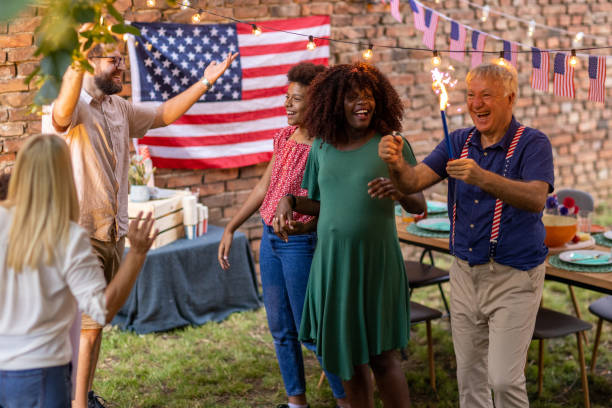 istock Multi-generationfamily having fun with sparklers while celebrating American holiday 1429970920