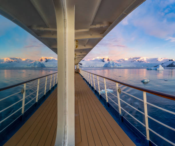 istock Cabin window reflection on a cruise ship at a dramatic sunset in wintry Cierva Cove - a deep inlet on the west side of the Antarctic Peninsula 1429971916