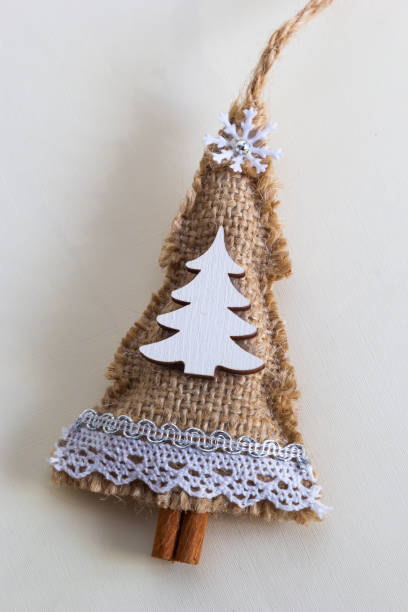 istock handmade Christmas tree toy, Christmas toy herringbone tree, burlap 1429975186