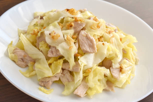 istock Cabbage and Pork Stir Fry on a white plate. 1429975631