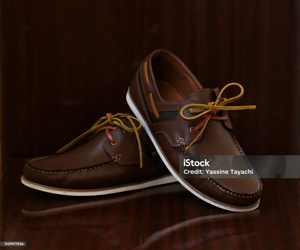Casual man brown loafer shoes posing in the urban street. Timberland - Arizona Stock Photo