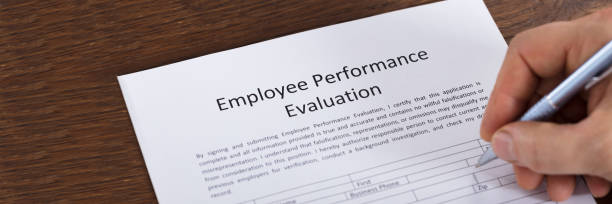 istock Person Filling A Performance Evaluation Form 1429977879