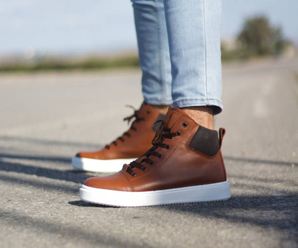 Mens Boots In Brown Leather With Timberland Look And Jeans On The Street Stock Photo - Image Now - iStock