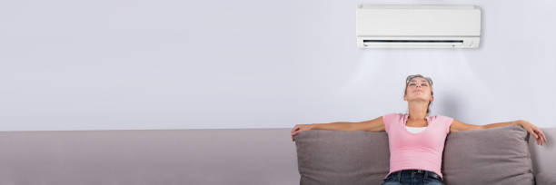istock Woman Relaxing Under The Air Conditioner 1429979125
