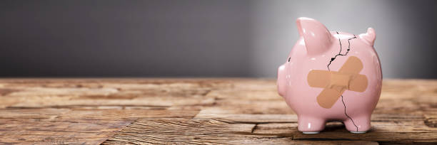 istock Broken Pink Piggybank With Bandage 1429980055