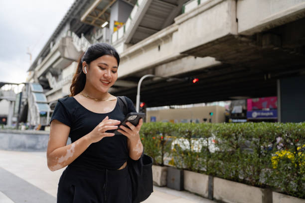 Attractive woman using high speed internet in smart city.