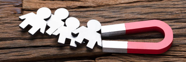 istock Magnet Attracting People On Wood 1429981073