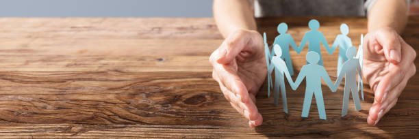 istock Person Protecting Paper Cut Out Figure 1429981480