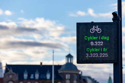 Copenhagen, Denmark  A sign showing the number of bicyclists crossing  the Queen Louise Bridge over Stone Lake per day and year.