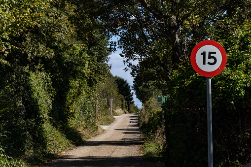 Copenhagen, Denmark An isolated dirt road with a speed limit sign.