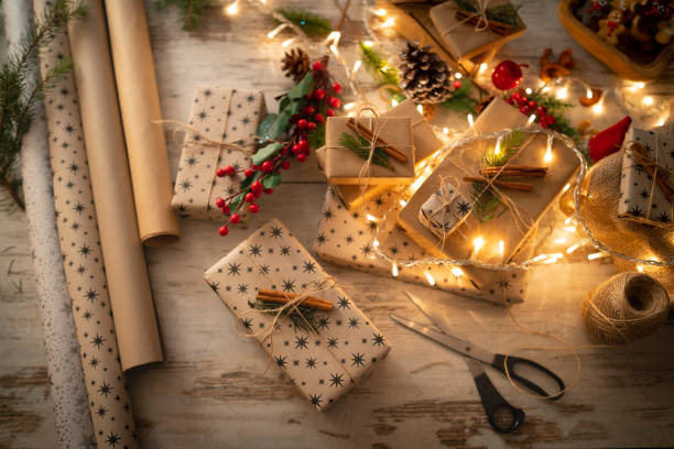 A tabletop of Christmas gift preparation stock photo