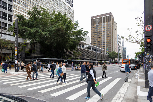 Sao Paulo, SP, Brazil, OCT, 2 2022, people walking on Paulista avenue towards polling places, democratic elections in Brazil in 2022