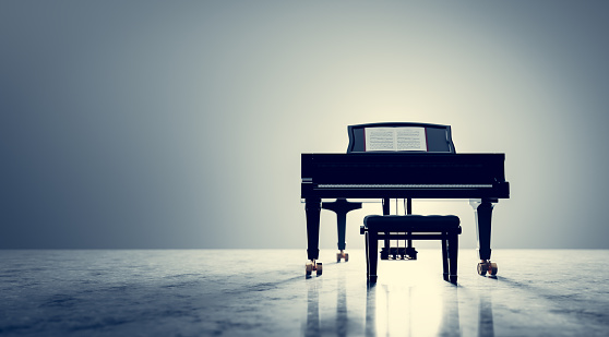 Classic grand piano keyboard in spotlight