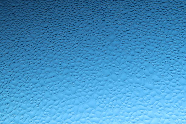 Drops Of Water On Glass, Blue Sky Background