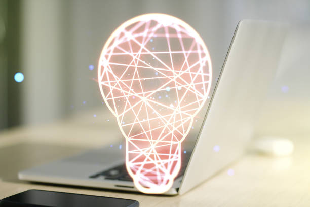 istock Double exposure of creative light bulb hologram on laptop background, research and development concept 1429991908