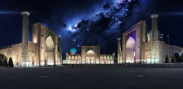 Registan square in Samarkand. Historical landmark located on the ancient silk road. Night view with Milky Way and stars on the background