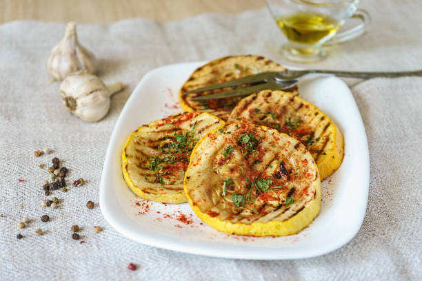istock Grilled zucchini on the table in a white plate. 1430000164