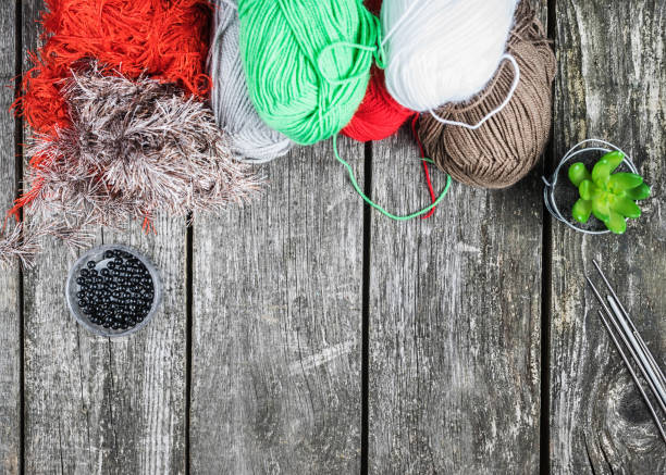 istock Wooden background with knitting threads and copy space 1430000217