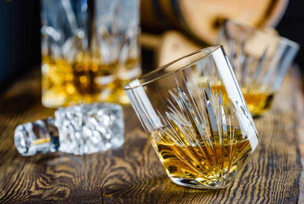 istock Whiskey in a crystal glass on a wooden background. 1430000220