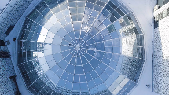 Aerial view on Modern glass building dome. glass dome background. glass roof in building. Top view on Modern radial glass dome of a modern building.