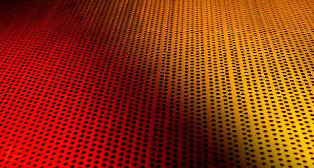 istock Red and yellow lights LED passing through metal sheet making abstract background 1430001274