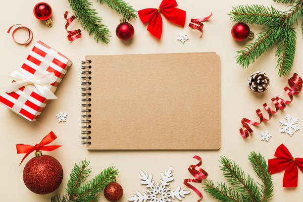 istock Christmas blank greeting card mock-up scene. Creative layout made of Christmas tree branches and paper card note. Flat lay. Nature New Year concept 1430004340