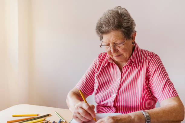 istock grandmother drawing with colored pencils 1430010064
