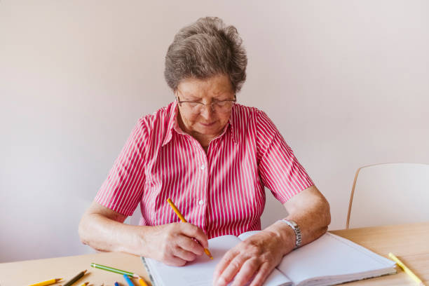 istock grandmother drawing with colored pencils 1430010109