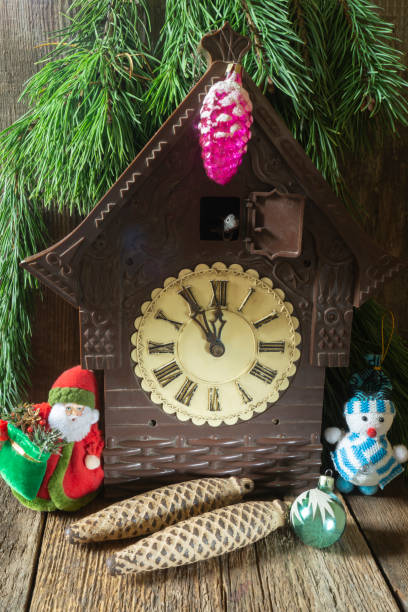 istock Old clock with Christmas toys under the Christmas tree 1430011007