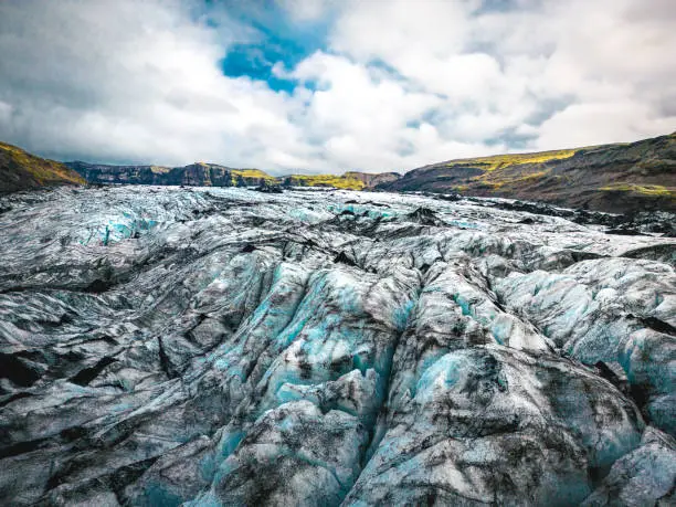 Photo of Close aerial shot of Sólheimajökull glacier ice melting