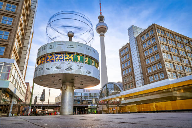 panoramic view on the Urania World Clock in Berlin and TV Tower on the Alexander Square long term exposure, panoramic view on the Urania World Clock in Berlin and TV Tower on the Alexander Square,  a tourist attraction and meeting place central berlin stock pictures, royalty-free photos & images