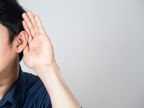Close-up man gesture listening isolated