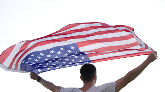 Young man with American flag.
