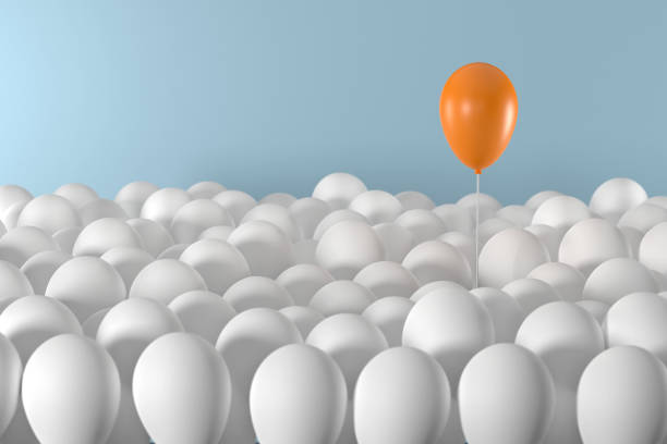 istock Orange Balloon Standing Out From The Crowd 1430025314