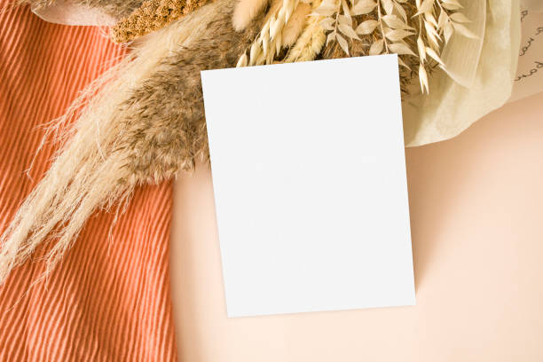istock Modern invitation mockup a5 with orange textile 1430029084